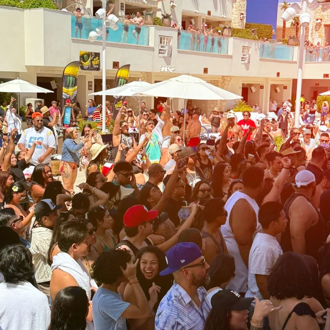Crowd at the pool during a Common Kings performance
