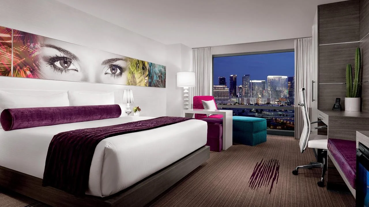 Ivory King hotel room with king bed